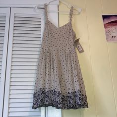 Floral Float Dress From Francescas Nwt. Size Small But Fits More Towards Extra Small. Does Not Fit Me. Beige Lined Casual Sundress, Casual Beige Lined Sundress, Flowy Beige Sundress For Dress Down Occasions, Beige Flowy Sundress For Casual Wear, Flowy Beige Sundress For Casual Wear, Casual Cream Lined Dresses, Float Dress, Cage Dress, Red Ruffle Dress