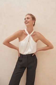 Elegant Sleeveless Bodysuit With Built-in Bra, Chic White Fitted Halter Top, Fitted Cream Camisole With Built-in Bra, Chic Stretch Tops With Lined Body, Elegant Summer Bodysuit With Built-in Bra, Chic White Backless Camisole, Elegant Spring Camisole Halter Top, White Fitted Feminine Halter Top, Chic White Stretch Halter Top