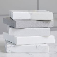 a stack of white and grey marble blocks