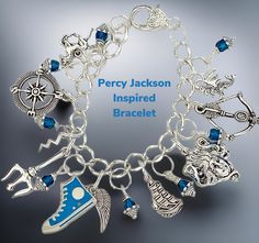 a silver bracelet with charms on it and the words, percy jackson inspired bracelet