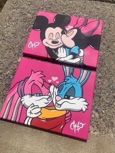 two mickey and minnie mouse paintings on pink canvases