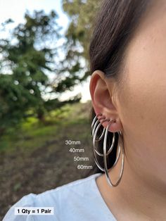 Item Details: This is for 1 Pair (= 2 Pieces). Size:  * 30mm  * 40mm  * 50mm  * 60mm  Item Details: The earrings are for 1 PAIR and only come in the CLIP-ON version for NON-PIERCED ears. These stainless steel clip-on hoop earrings use a spring closure and look very realistic (like pierced earrings). More color/size: * Silver Small (11-18mm): https://clipsody.etsy.com/listing/1447440109  * Gold Small (11-18mm): https://clipsody.etsy.com/listing/1427933739 * Gold Large (30-60mm): https://clipsody.etsy.com/listing/1732357881  * Rose Gold Small (11-18mm): https://clipsody.etsy.com/listing/1564368041  * Rose Gold Large (30-60mm): https://clipsody.etsy.com/listing/1718185720  Shipping: * US customers: Receive FREE US shipping by making an order of $35 or above from my shop. * Non-US customers: I Earrings No Piercing, Earrings For Men, Earrings Minimalist, Pierced Earrings, Silver Hoops, Pierced Ears, Minimalist Earrings, Earings Piercings, Clip On