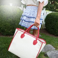 Raffia straw tote with red scalloped panels. The perfect carryall for the beach and beyond. 35" width and 30" height. Red Straw Bag For Summer Vacation, Red Straw Bag For Summer Shopping, Red Basket Beach Bag For Summer, Red Straw Vacation Bags, Red Rectangular Straw Bag For Spring, Red Straw Bags For Vacation, Red Summer Beach Bag For Spring, Red Summer Straw Bag For Beach Season, Red Straw Bag For Beach Season