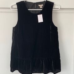 Beautiful Brand New J.Crew Black Velvet Sleeveless Top With Ruffles On Bottom. No Flaws. Size 2, Small Fall Sleeveless Tank Top, Black Sleeveless Blouse For Fall, Fall Sleeveless Blouse For Workwear, Fall Workwear Sleeveless Blouse, Sleeveless Blouse For Fall Workwear, Black Ruffled Sleeveless Tank Top, Black Sleeveless Crop Top With 4-way Stretch, Black Sleeveless Moisture-wicking Crop Top, Long Sleeve Ruffle Top