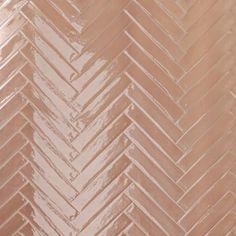 a close up view of a herringbone tile pattern