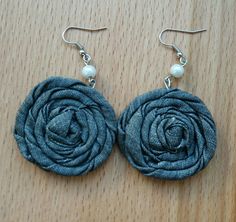 the earrings are made with fabric and pearls