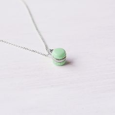 Cute mini mint macaron pendant necklace perfect for Christmas Gift handmade with love by our California studio. Macaron Size: 7x7 mm Chain Size: 17 inches long, 1.2mm thickness, 2 inches extender  Material: Polymer Clay This item is made to order, please allow between 1-3 business days for your item to be made Shipping & Policies Please check Shipping & Policies for important information Necklace Pink And Green Boba, Kawaii Pendant Jewelry Gift, Macaron Necklace, Mini Terrarium Necklace, Blue Donuts, Cupcake Necklace, Christmas Gift Handmade, Dessert Food, Food Jewelry