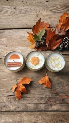 three small plates with food on them next to autumn leaves