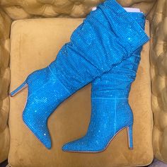 Brand New In Box From Gianni Bini, The Salaya Rhinestone Slouchy Tall Boots Feature: Fabric Upper With Allover Rhinestone Embellishment Slouchy Boot Shaft Design Full Inside Zipper Closure Synthetic Lining Padded Memory Foam Sock Synthetic Outsole Approx. 15" Shaft Height Approx. 3.54" Heel Height Beutiful Turquoise Color! Size 6 Wide Calf Blue Pointed Toe Boots With Rhinestones, Blue Rhinestone Boots With Pointed Toe, Blue Rhinestone Pointed Toe Boots, Blue Embellished Party Boots, Embellished Blue Party Boots, Blue High Heel Boots With Rhinestones, Blue Party Boots With Rhinestones, Blue Rhinestone Party Boots, Glamorous Blue Rhinestone Boots