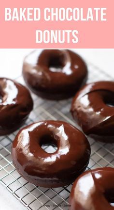 baked chocolate donuts on a cooling rack with text overlay