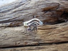 "Eye of Horus ring...3/8\" wide at widest spot, cast in sterling silver 925...ring is a size 8 and can be sized from size 5 to size 8, so when ordering put the size needed in the notes or conversations on the order page....thanks, Bill" Silver Symbolic Toe Rings, Adjustable Spiritual Sterling Silver Engraved Ring, Symbolic Sterling Silver Rings Stamped 925, Handmade Adjustable Sterling Silver Engraved Ring, Symbolic Sterling Silver Stackable Promise Rings, Handmade Symbolic Sterling Silver Engraved Ring, Unique Hypoallergenic Sterling Silver Rings, Symbolic Hand Cast Adjustable Rings, Symbolic Silver Hypoallergenic Rings