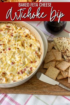 baked feta cheese artichoke dip with crackers on the side