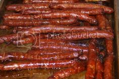 many sausages are lined up on a table