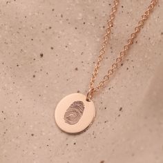 The Chiara necklace is a light gold round disc necklace that you just NEED. Whether you wear it alone or stacked, with your another necklace or bare alone- it's perfect. Add a personal touch to your Chiara necklace with an engraved fingerprint of a loved one. If you can dream it- we can make it happen. Chain Length: Length: 42cm/16" (extension: 3cm/1.8") Total 45cm/18" Element: Size: 10mm All features can be customized! Talk to us, we love making custom designs. Our jewelry is carefully handmade in our atelier Hand Stamped Minimalist Pendant Necklace, Minimalist Hand Stamped Pendant Necklace, Rose Gold Round Disc Necklace For Everyday, Everyday Rose Gold Round Disc Necklace, Dainty Engraved Round Pendant Coin Necklace, Dainty Hand Stamped Round Necklaces, Minimalist Engraved Round Disc Jewelry, 14k Gold Round Disc Charm Necklace, Minimalist 14k Gold Medallion Necklace For Gift