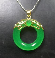 Genuine Yellow Gold Plate Icy Green Jade Circle Donut Pendant Necklace with 18 inches Gold Plated Chain ** It include Yellow Gold plate Chain ** Include Jewelry Pouch ** Free ** Jade 100% Real China Northern Jade Jade Enhance by Heat Size  34 mm X 30 mm X 8 mm Color ** See Photo ** ** Green Color ** Picture Due to our low photography level, the real item is much better then the picture Luxury Jade Necklaces For Meditation, Luxury Jade Round Bead Jewelry, Luxury Jade Jewelry With Round Stone, Green Circular Jewelry Gift, Green Circle Jade Necklace, Circular Green Jade Necklace, Green Jade Circle Necklace, Jade Jewellery, Donut Pendant