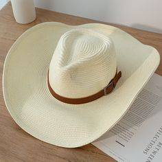 Discover the Perfect Blend of Style and Functionality Step out in style this summer with our New Design Natural Paper Western Cowboy Hat. Whether you're heading to the beach, a music festival, or just enjoying a sunny day outdoors, this hat is your ultimate accessory. Crafted with a blend of natural paper and polyester, it offers a lightweight and breathable fit, making it ideal for warm weather. Versatile and Unisex This cowboy hat is designed for both men and women, offering a unisex appeal that fits seamlessly into any wardrobe. Its solid pattern and casual style make it a versatile piece that complements any outfit, whether you're going for a laid-back beach look or a more polished summer ensemble. Key Features Material: Natural paper and polyester for a lightweight, breathable feel. B Adjustable Flat Brim Bucket Hat For Summer, White Country Style Panama Hat For Outdoor, Country Style White Panama Hat For Outdoor, Summer Outdoor Straw Hat, White Hat For Beach Season Travel, White Panama Hat For Beach Season Outdoor Activities, Summer Outdoor Hat With Short Brim, White Travel Hat For Beach Season, White Beach Hat For Travel