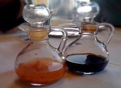 three different types of liquid in glass containers