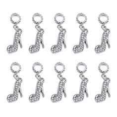 six pairs of charms with music notes on them