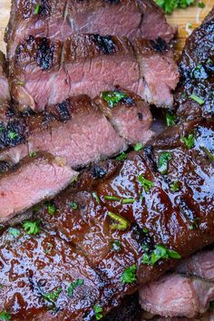 sliced steak and broccoli on a cutting board