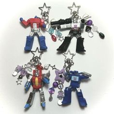 ‧₊ ᵎᵎ ⋅ ˚✮ G1 Transformers Keychains Ver. 2*ੈ → FREE SHIPPING for USA $35+  assorted beads + silver plated charms, strong jewelry wire, stainless steel findings/chains ❀ Care tip: In order to keep your charm in good condition, please keep it away from water 🫧⋆｡˚instagram & tiktok: @batbeadsco Prime Starscream, Transformers Illustration, G1 Transformers, Nerdy Outfits, 80s Cartoon, Dope Jewelry, Transformers Art, Etsy Instagram, Mini Things