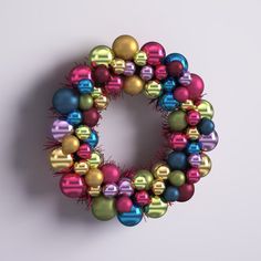 a colorful christmas ornament hanging on a wall