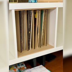 a book shelf filled with lots of records