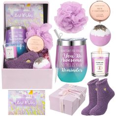 a purple gift box filled with personal care items and a candle, socks, candlesticks