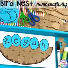 a bird nest and name craft with scissors, paper strips and crayon markers