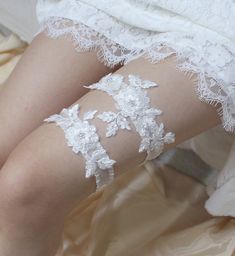 "Gorgeous white lace garter set - rhinestone, silver beads and sequin are embroidered on the lace, match the stretchy organza band for comfortable fit. This gorgeous and glittering garter set will make your special day shine even brighter. * Set of garter (Keepsake and toss garter ) * Keepsake garter lace measured approximately 6\" X 2.5\" * Toss garter lace measured approximately 3.5\" x 1.5\" * Stretch organdy band - white, ivory and light blue * Comes with a pink box. CUSTOM ORDER Please choo Fitted Lace Bridal Belt For Bride, Fitted Lace Bridal Belt For Ceremony, Fitted Lace Bridal Accessories For Bride, White Fitted Bridal Belt For Ceremony, Fitted White Lace Bridal Belt, White Fitted Lace Bridal Belt, Embellished White Lace Bridal Belt, White Embellished Lace Bridal Belt, White Beaded Lace Bridal Accessories