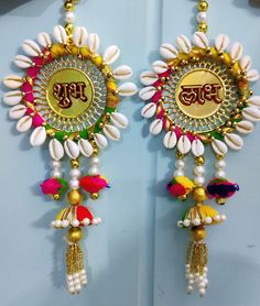 the earrings are decorated with beads and tassels