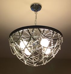 a chandelier hanging from the ceiling in a room