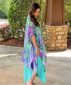 The Vacay My Way Sunrise Print Tassel Kimono is the perfect addition to any vacation wardrobe. This kimono is designed with a stunning sunrise print in shades of pink, green, and purple, evoking feelings of warmth and relaxation. The playful tassel detailing adds a touch of fun and whimsy, making this kimono the perfect accessory for any summer adventure.
This kimono is versatile and can be worn as a swimsuit cover-up or layered over a dress for a stylish look. The lightweight and flowy fabric m Multicolor Cover-up For Vacation Day Out, Tropical Multicolor Cover-up For Day Out, Colorful Summer Kimono With Kimono Sleeves, Vibrant Multicolor Kimono For Vacation, Vibrant Spring Vacation Cover-up, Casual Multicolor Kimono For Vacation, Green Beachwear Kimono For Spring, Multicolor Vacation Cover-up For Day Out, Spring Beachwear Green Kimono