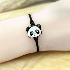 Adjustable cord bracelet Panda Bear Kawaii handmade with shrink plastic and covered with resin ... As all of our products are handmade with all our love and dedication, all of them are one of a kind. The bracelet is waterproof. Adjustable with macramé sliding knot, which makes it easy to put it on and take it off. The bracelet is finished with two steel balls, completely hypoallergenic. You'll find it available in other options, so make sure to check out this link : https://www.etsy.com/shop/Mon Adjustable Kawaii Jewelry With Cute Design, Adjustable Cute Kawaii Jewelry, Kawaii Jewelry With Cute Adjustable Design, Adjustable Jewelry With Cute Design Gift, Kawaii Black Jewelry Gift, Adjustable White Jewelry With Cute Design, White Jewelry With Cute Adjustable Design, Cute Hypoallergenic Friendship Bracelets As Gifts, Handmade Kawaii Jewelry For Friendship