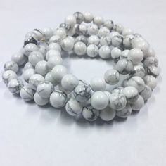 High Quality Natural Howlite Gemstone Beads. Quantity:  One 15"  strand - approx. 48 beadsShape:   RoundSize:   8mmFinish: Smooth ShinyFind more gemstone strands here: https://www.etsy.com/shop/thebeadgalleryA2?section_id=24259658Processing time:1-3 daysShipping:2-5 days standard USPS shipping methods. White Round Gemstone Beads, Round Beaded Bracelets With 108 Beads For Jewelry Making, Hand-strung White Round Bead Necklaces, White Round Beaded Necklace 8mm, White Hand-strung Round Bead Necklaces, White Round Hand-strung Beads, White Necklace With 8mm Beads, White 8mm Healing Beads, White Round Spacer Beads