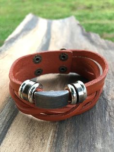 Brown Leather Bracelet for men, Men's Jewelry Gift, Handmade leather Bracelet, Braided Leather Bracelet Charm, plait. O4M-B55 Sign-up now for our Newsletter and receive a 10% Discount on your first order! https://mailchi.mp/7f649f87eb6c/only4men-newsletter This is a beautiful piece of jewelry, a unique and original Gift for Him!  The Brown Braided Bracelet length is about 8 inches. This will fit most wrist sizes, but please make sure before you order this will fit your wrist size. The closure system makes it very easy to put on and to remove. Simple clips. Made out of real leather, this Brown Braided bracelet is very durable and comfortable. Don't hesitate to contact me if you have any questions! Rustic Adjustable Bracelet With Waxed Finish, Rustic Adjustable Leather Strap Bracelets, Brown Waxed Finish Bracelet, Adjustable Rectangular Leather Bracelet, Rustic Adjustable Leather Bracelet With Waxed Finish, Adjustable Wristband Bracelet For Father's Day, Adjustable Brown Wristband For Father's Day, Leather Bracelet For Men, Husband Valentine