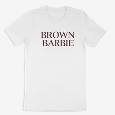 Be the definition of cool with this Brown Barbie Tee! It's unisex fit is perfect for all fans of Barbie, making you the envy of all your friends. Plus, with 3-7 business days for processing, you'll be ready to rock in no time! Unisex Letter Print T-shirt In Pop Culture Style, Unisex Pop Culture T-shirt With Letter Print, Unisex T-shirt With Text Print For Fan Merchandise, Unisex Letter Print T-shirt Fan Merchandise, Unisex Letter Print T-shirt For Fans, Brown Barbie, Be Ready, Large White, No Time