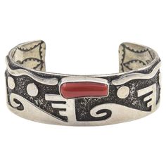 Navajo Zuni Native American artist Alex Sanchez is legendary for his petroglyphs designs in sterling silver. This stunning cuff bracelet is a perfect example of his work that also has a red Italian coral accent. A petroglyph is an image created by removing part of a rock surface by incising, picking, carving, or abrading, as a form of rock art. Sanchez applies this Native American style to sterling silver. The underside of this piece has an ornate design as well has the artist's name and sterlin Coral Accents, Bones Bracelet, Navajo Nation, Native American Artists, Sterling Silver Cuff Bracelet, Native American Fashion, Design Silver, Sterling Silver Cuff, Silver Cuff Bracelet