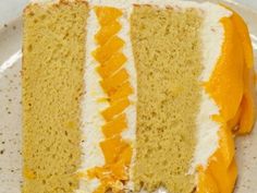 a slice of cake with white and orange frosting