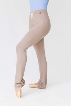 Introducing the Warm-Up Tight! These cozy tights are designed to keep you warm between rehearsals, class and backstage. Fitted throughout, these tights flatter leglines. Features include an elastic at the bottom hem for added functionality- hook under the heel to keep ankles warm, or roll up for a shortened style. This highwaisted design features an elastic waistband with incorporated drawstrings. The Poly/Rayon/Spandex blend fabric offers maximum stretch and pillow soft comfort. These Warm-Up T Tan Tights, Baby Bloomers, Princess Seam, Crushed Velvet, Wrap Skirt, Roll Up, Dance Wear, Leotards, Hosiery