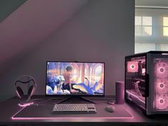 a desktop computer sitting on top of a desk next to a keyboard and mouse in front of a monitor