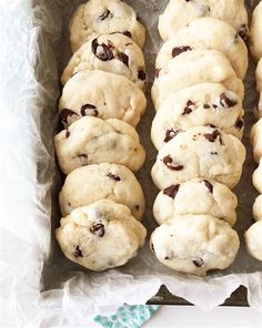 several chocolate chip cookies in a white box