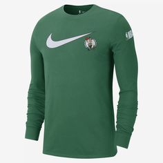 the nike long sleeve shirt has a green and white design on it, with a red rose in the center