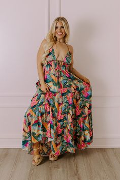 - Grab an umbrella drink and step into tropical style with this beautiful maxi! - Unlined lightweight material with a colorful abstract botanical print -A deep-v neckline featuring a tie detail with accent tassels - Halter tie closure with accent tassels - An open back - A smocked lower bodice - Hidden side pockets - A flowy yet flattering silhouette that ends in a straight ankle length hemline Abstract Botanical, Tropical Style, Botanical Print, Colorful Abstract, Botanical Prints, Ankle Length, Open Back, Umbrella, Bodice