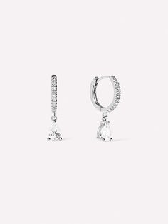 For all of our ice queens out there, we made you these delicate silver huggie hoops. These rhodium-dipped huggies are littered with cubic zirconia gems, so you get the maximum amount of sparkle in such a tiny package. These huggie hoops deliver such a bold statement, so they can stand out on their own but always enjoy some ear company. If youre straying away from silver, our Elise earrings also come in gold!  Rhodium-dipped huggie hoops  Features cubic zirconia gems  365-day warranty Sterling Silver Sparkling Stones Huggie Earrings, White Gold Sterling Silver Huggie Earrings With Sparkling Stones, Sterling Silver Huggie Earrings With Sparkling Stones, Silver Sparkling Huggie Earrings, Silver Teardrop Hoop Earrings With Diamond Accents, Teardrop-shaped Silver Hoop Earrings With Prong Setting, Silver Teardrop Hoop Earrings With Prong Setting, Ice Queen, Every Single Day