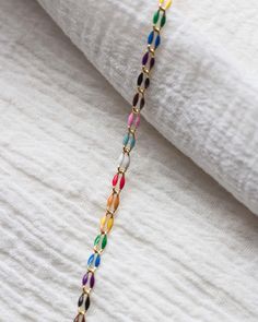 Length: 4 feet Enamel footage chain (unfinished chain) 18k gold plated. Base: brass. Finish: 18k gold. Links measure approximately 6mm x 3mm Colors: Red, orange, yellow, green, blue, purple, black, brown, light blue, light pink, white Style ID: GP106 Suggested jump ring for permanent jewelry: JR8 - www.etsy.com/listing/1467647210 More From Our Shop  bayandstew.etsy.com New items added weekly. Stay updated on Instagram: @bayandstew About Bay & Stew Supplies We are your go to shop for hand stampin Cheap Multicolor Adjustable Chain Jewelry, Rainbow Chain Jewelry, Cheap Rainbow Beaded Chain, Japanese Pearls, Permanent Jewelry, Charm Holder, Jewelry Roll, Rainbow Jewelry, Bleu Violet