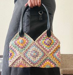 Ready To Ship 🌸 Add a pop of color to your ensemble with our vibrant knitted bag showcasing an array of soft hues. Handcrafted with care, this bag features a delightful rainbow of colors, perfect for adding a playful touch to any outfit. The bag is lined for durability and features a convenient snap closure to keep your belongings secure while on the move. Plus, it includes an interior pocket, providing added organization for your essentials. Whether you're running errands or heading out for a Multicolor Crochet Bag With Braided Handles For Shopping, Multicolor Crochet Bag With Braided Handles For Spring, Spring Multicolor Crochet Bag With Braided Handles, Multicolor Crochet Shoulder Bag For Everyday Use, Colorful Casual Crochet Shoulder Bag, Retro Multicolor Crochet Bag For The Beach, Multicolor Knitted Tote Bag, Trendy Multicolor Crochet Bag For Shopping, Retro Multicolor Crochet Bag For Beach