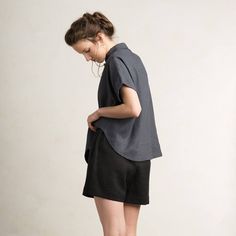 "Beautiful loose fit linen women's shirt with short sleeves. Composition: 100% linen Closure: black buttons SIZE CHART: *Loose fit XS/S bust - 27.5\"-35.5\" / 70-90cm waist - 21.5\"-31.5\" / 55-80cm hips - 31.5\"-47\" / 80-120cm height - 61\"-66\" / 155-168cm *Loose fit S/M bust - 31.5\"-39.5\" / 80-100cm waist - 23.5\"-35.5\" / 60-90cm hips - 35.5\"-51\" / 90-130cm height - 64.5\"-70\" / 164-178cm *Loose fit M/L bust - 35.5\"-51\" / 90-130cm waist - 31.5\"-43.5\" / 80-110cm hips - 39.5\"-55\" / Versatile Black Linen Top, Black Linen Shirt For Spring, Black Linen Short Sleeve Tops, Modern Short Sleeve Blouse For Everyday, Relaxed Fit Linen Short Sleeve Shirt For Work, Black Shirttail Hem Blouse For Summer, Modern Linen Blouse With Relaxed Fit, Short Sleeve Black Blouse For Everyday, Black Short Sleeve Blouse For Everyday