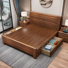 a wooden bed with drawers underneath it in a living room next to a large window