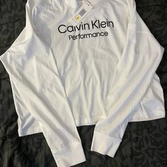 Women’s Brand-New Long Sleeve Calvin Klein T-Shirt. Calvin Klein White Logo Print T-shirt, Calvin Klein Crew Neck T-shirt For Spring, Spring Stretch Tops With Logo Print, Spring Streetwear Tops With Branding, Athleisure Tops With Logo Print For Loungewear, Cotton Tops With Logo Print For Spring, Cotton Top With Logo Print For Spring, Spring Cotton Top With Logo Print, Spring Athleisure Top With Letter Print