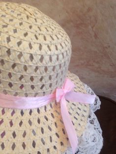 This is a beige straw hat trimmed in white lace with light pink satin ribbon and lovely pink flower. This hat fits smaller girls 18-20.5 inches head circumference. Spring Garden Party Hat With Ribbon, Spring Cream Hat With Ribbon, Feminine Pink Beach Hat, Spring Crochet Cloche Hat, Adjustable Pink Hat With Ribbon, Pink Adjustable Hat With Ribbon, Spring Mini Hats With Ribbon, Pink Adjustable Ribbon Hat, Pink Wide Brim Crochet Hat For Spring